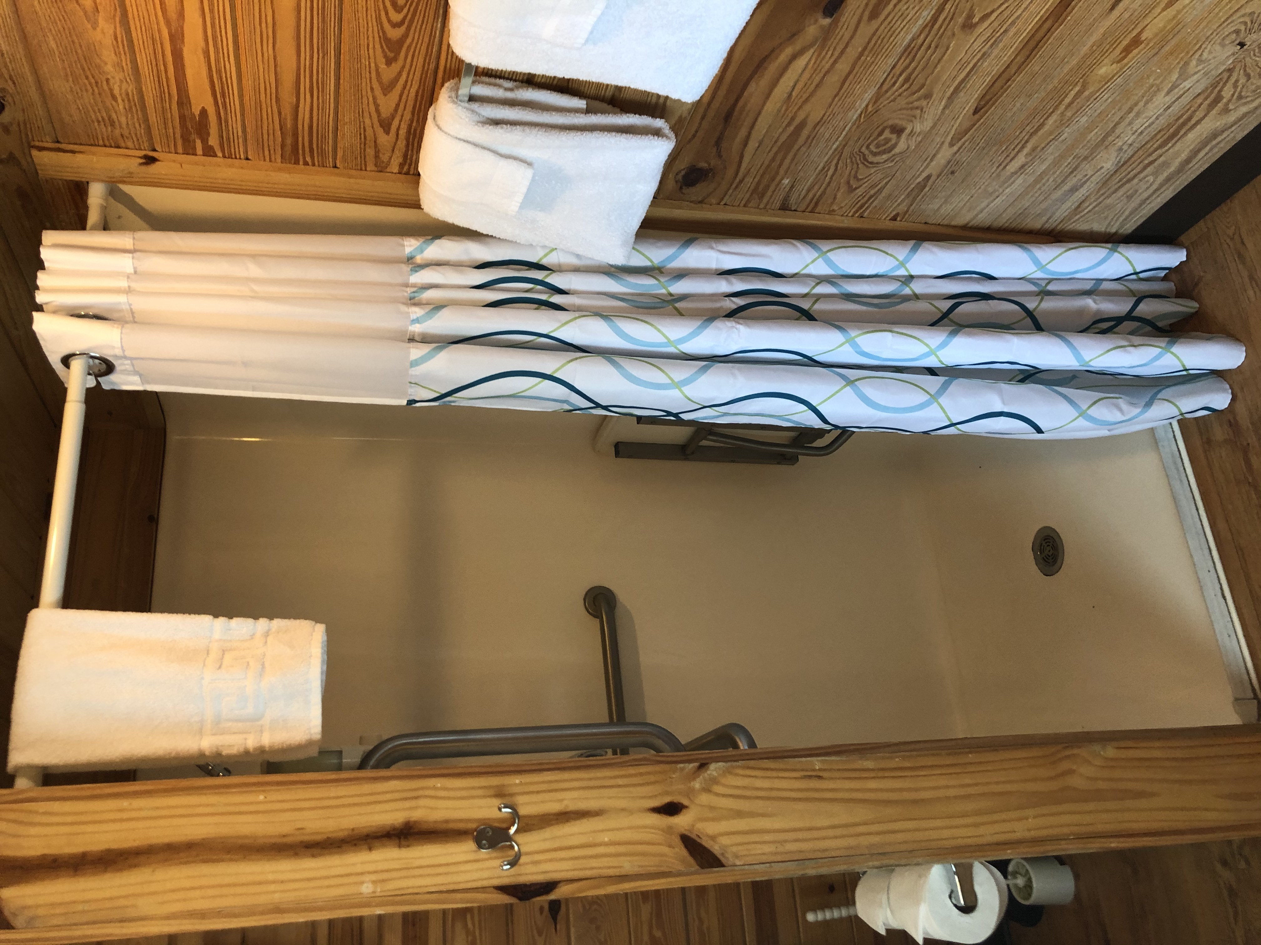 Handicap accessible shower with transfer seat