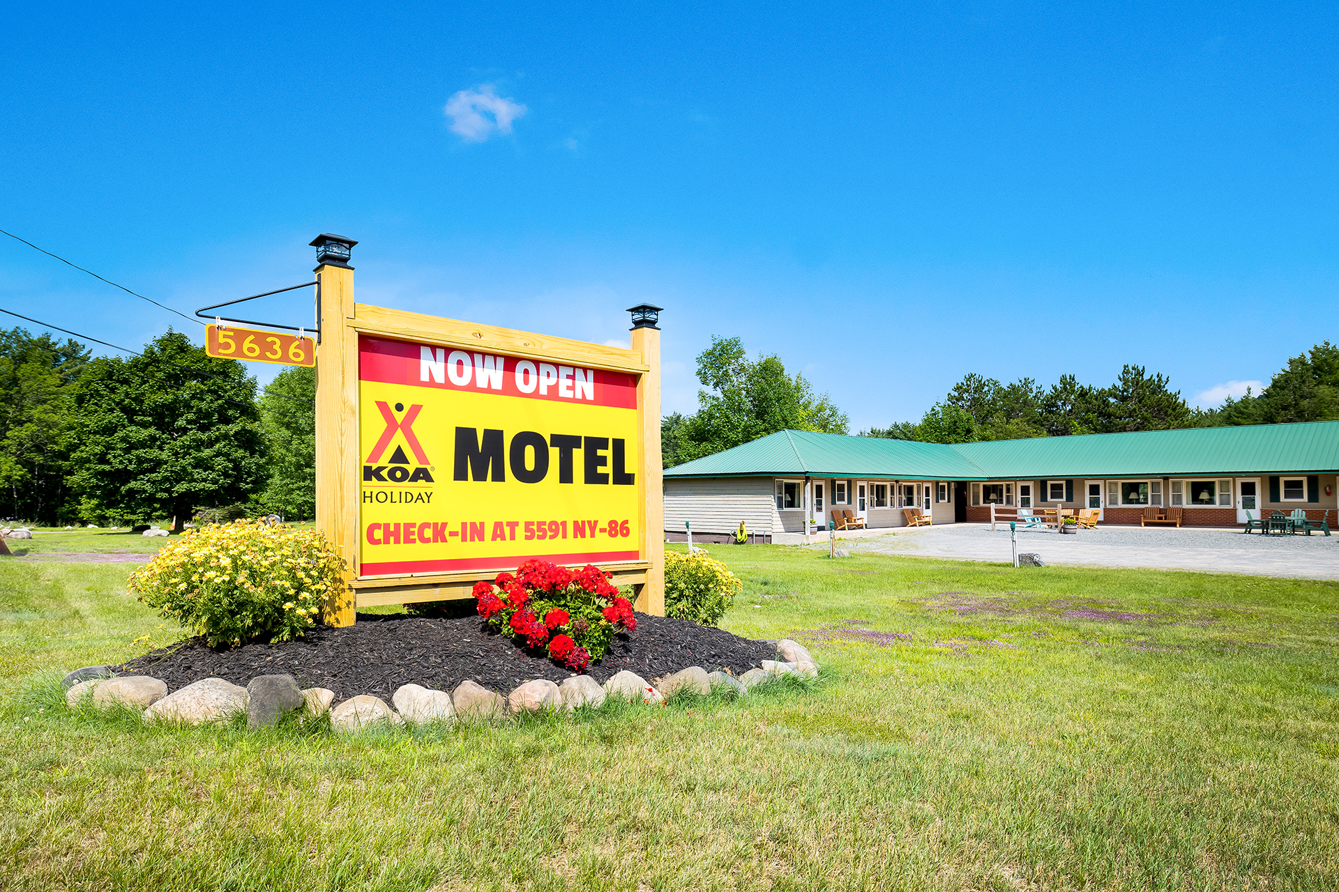 Motel Exterior with Now Open Sign