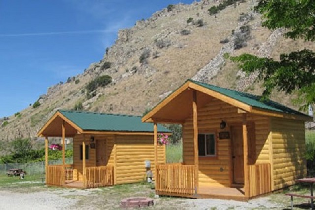 Camping Cabins #C60, C61, C62 and C66. 1 double bed, 1 set of bunks. No bathroom, close to bath house.
