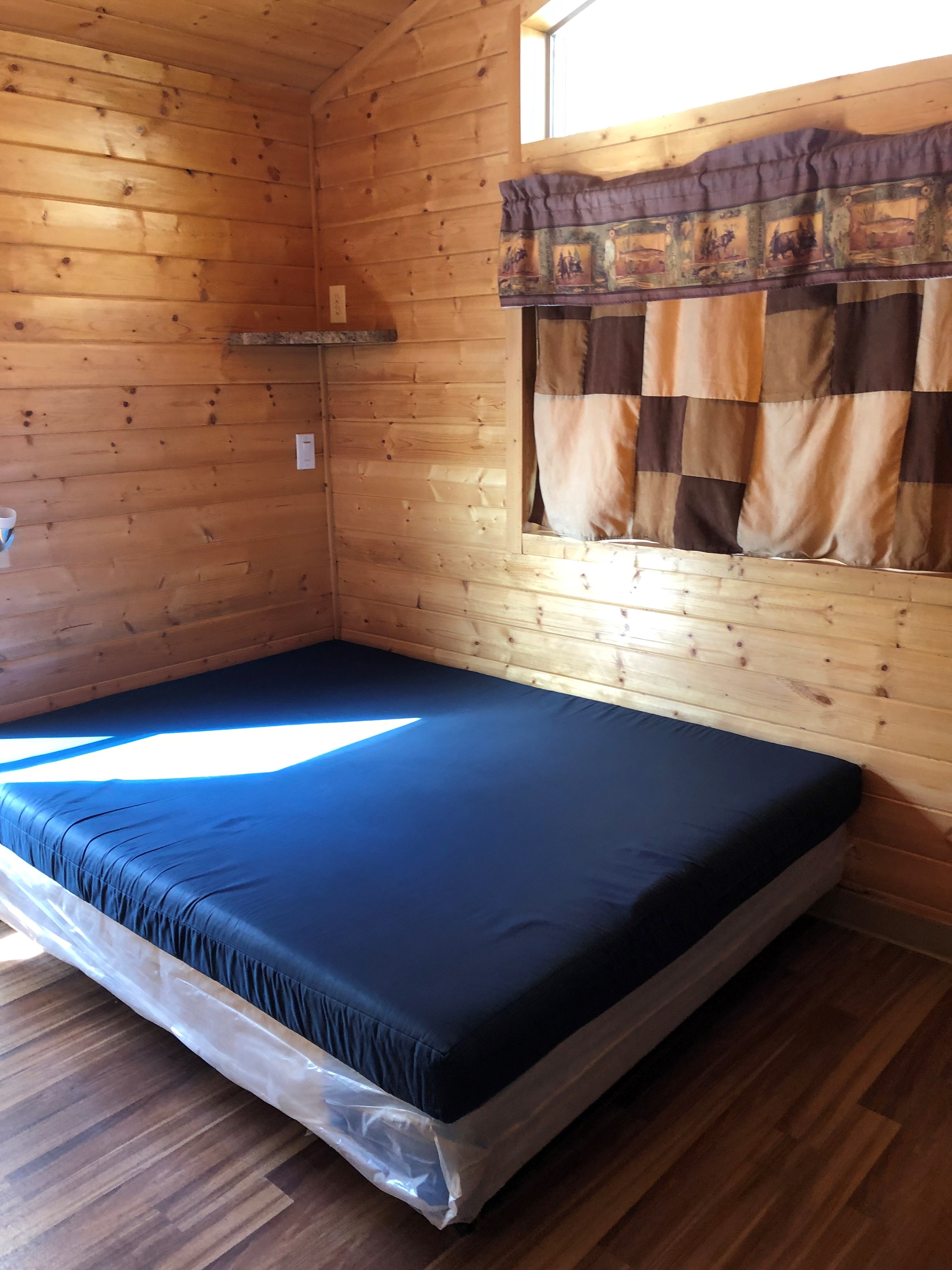 L33 cabin bedroom with queen bed.