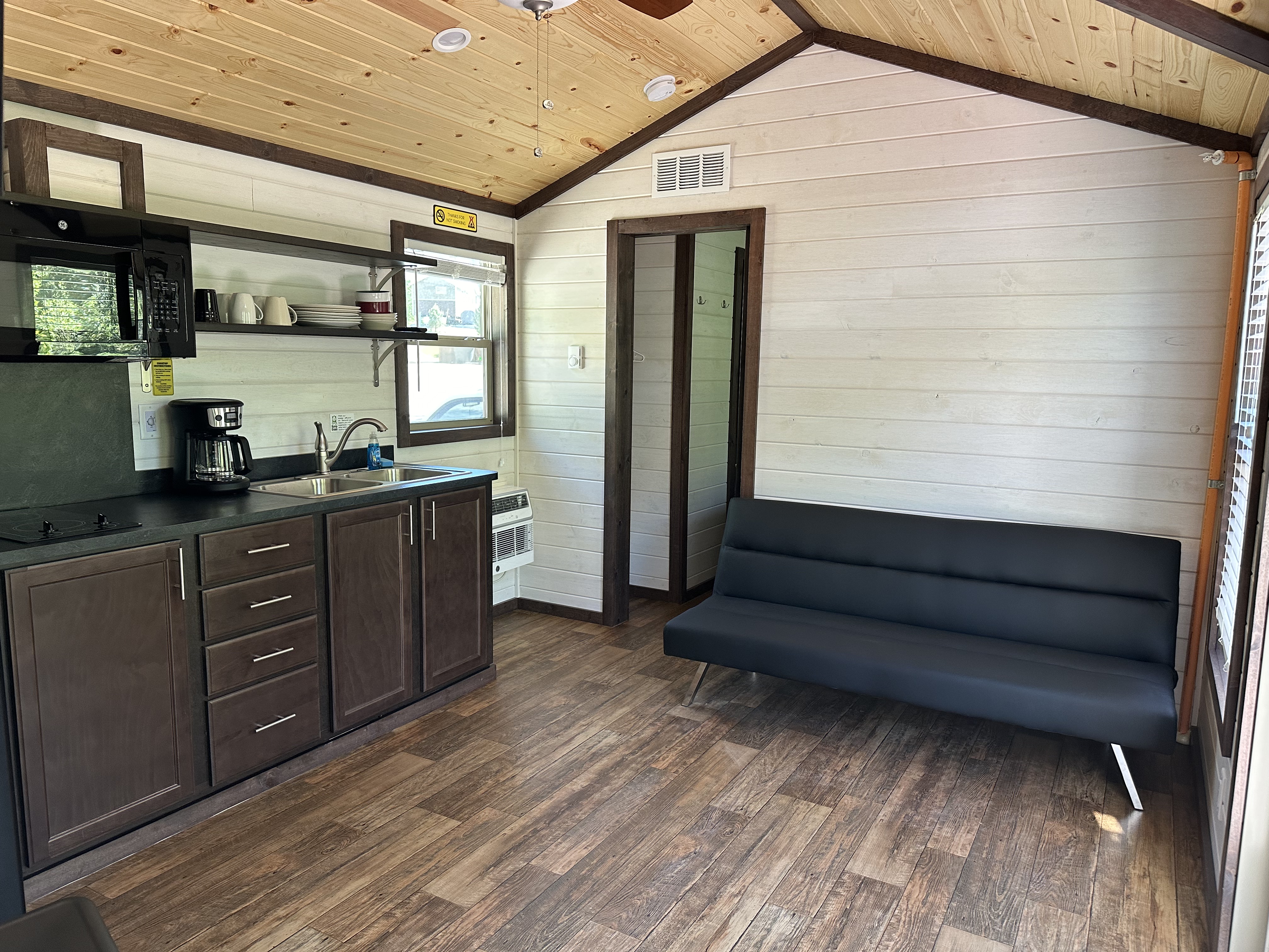 Cabins L50 & L203 Kitchenette area with Futon/TV.
