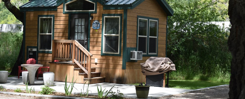 Cabins #L30, L31, L32. Bathroom, 1 double bed, 1 set of bunks. Bring own sleeping bags, pillows, and towels.