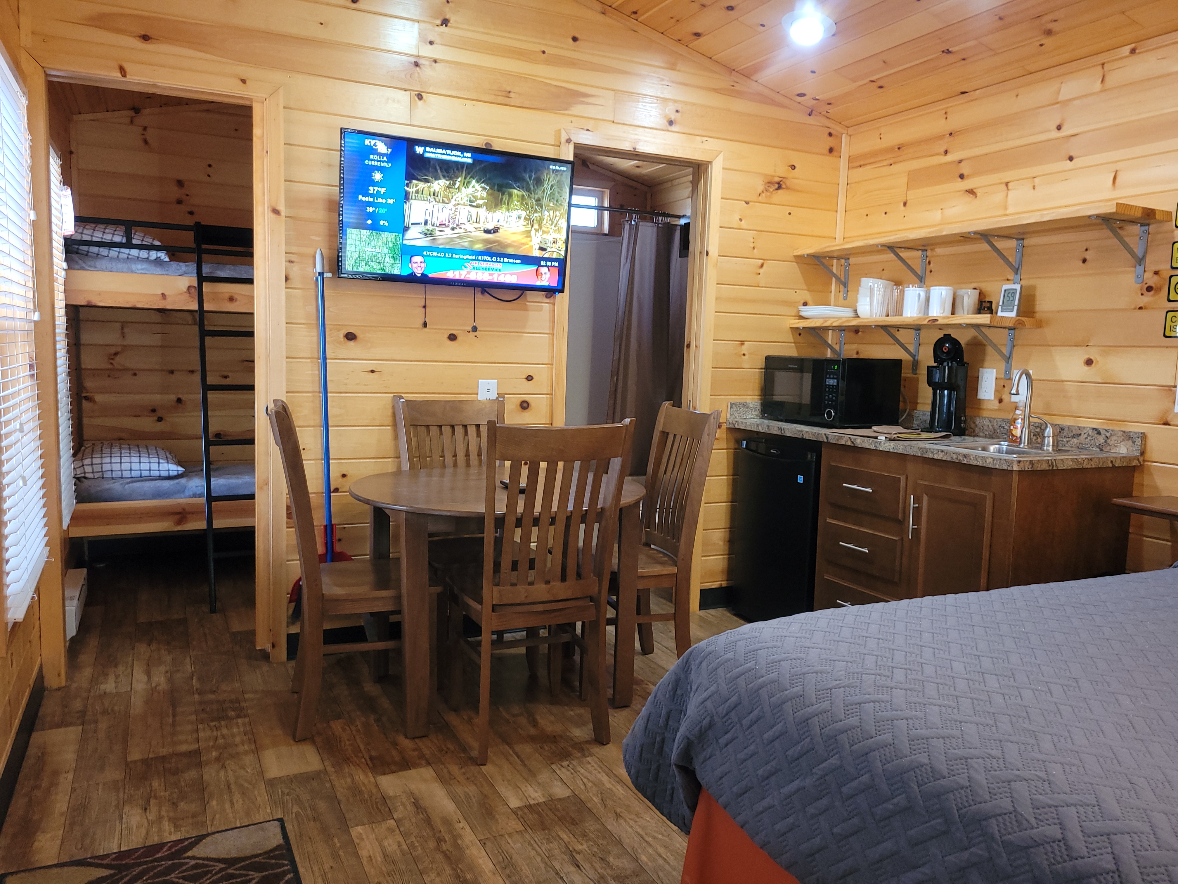Kids bunks and bathroom in the two corners of cabin.