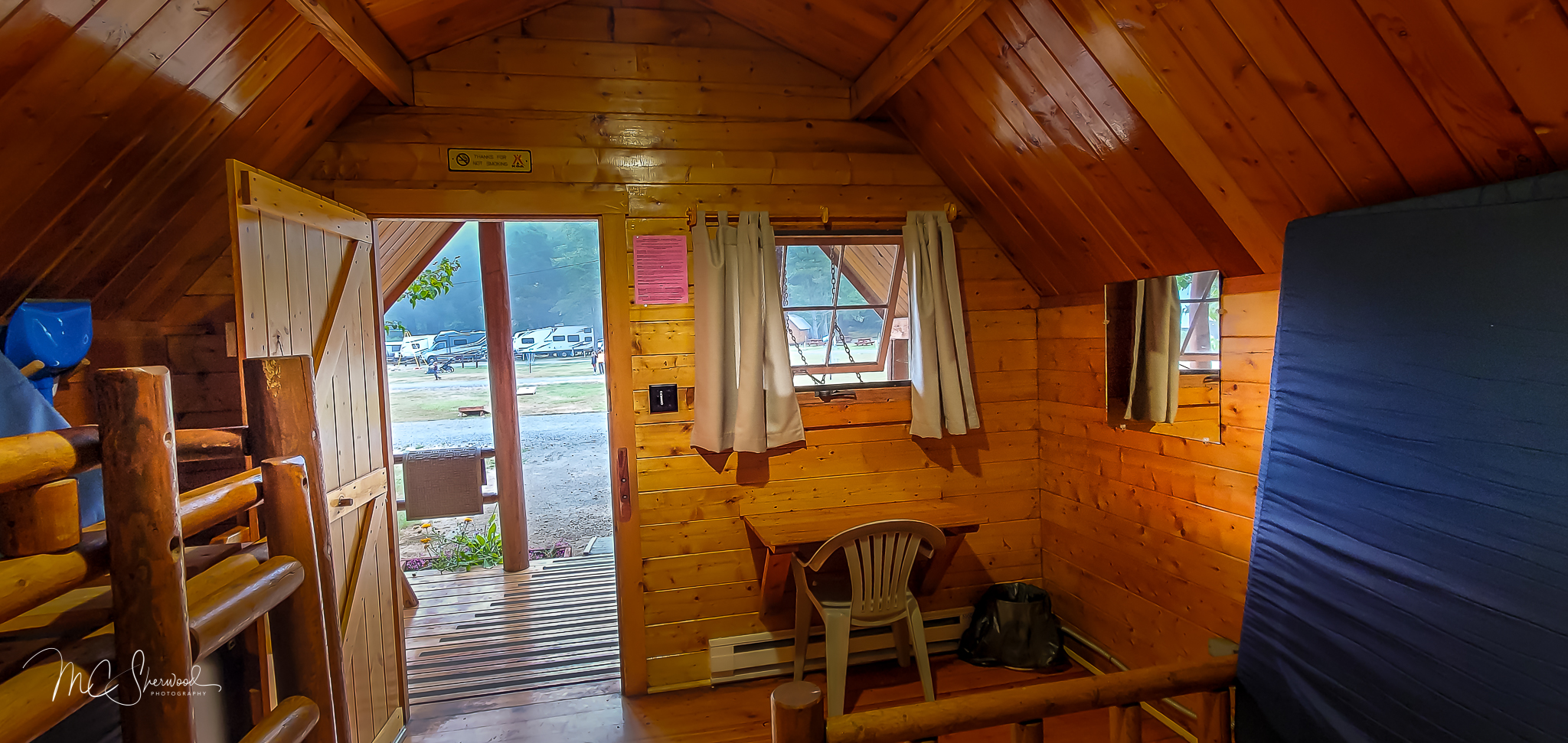 One-room rustic camping cabin interior