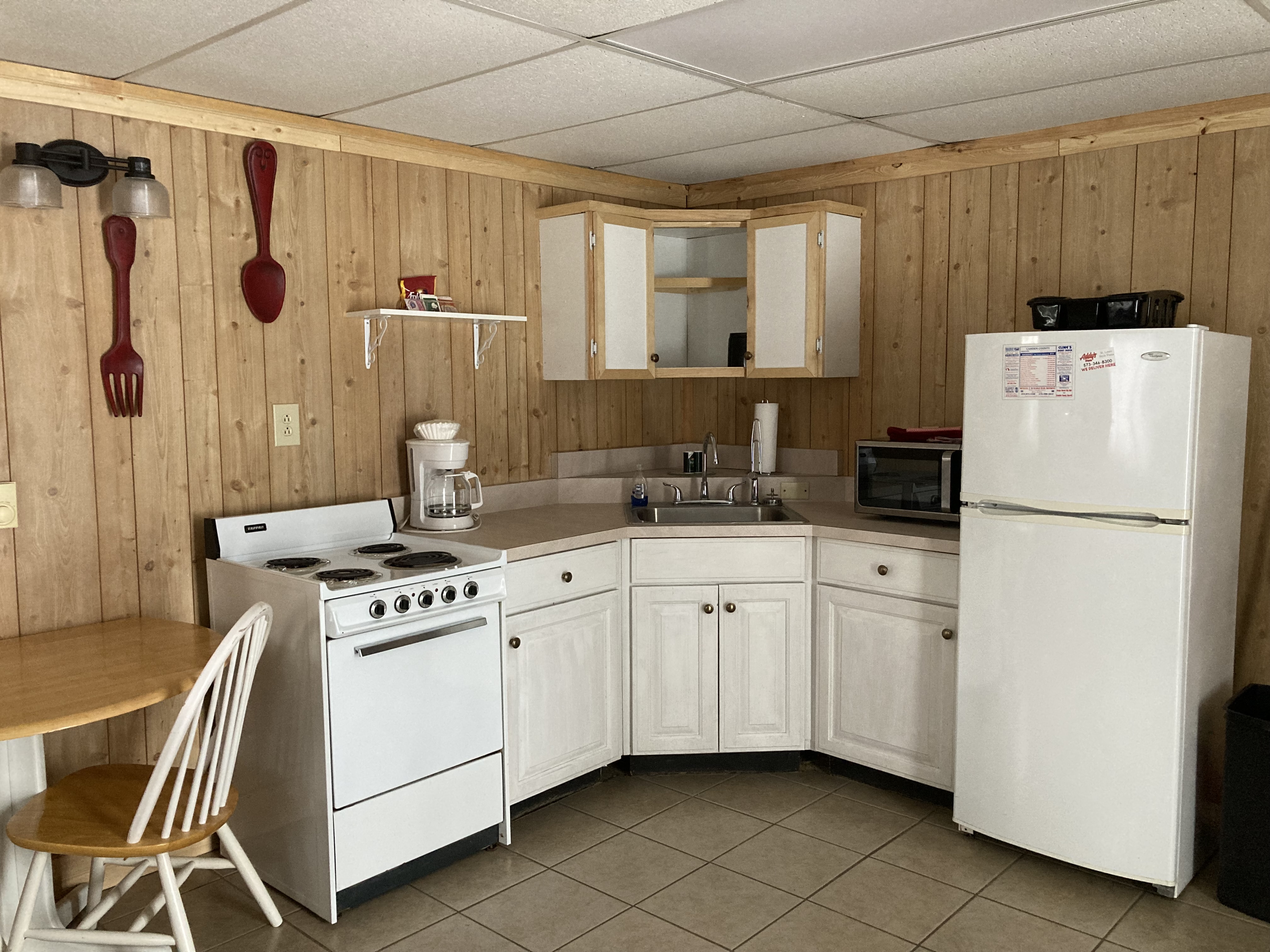 Downstairs apartment kitchen.  Has stove, sink, refrigerator.