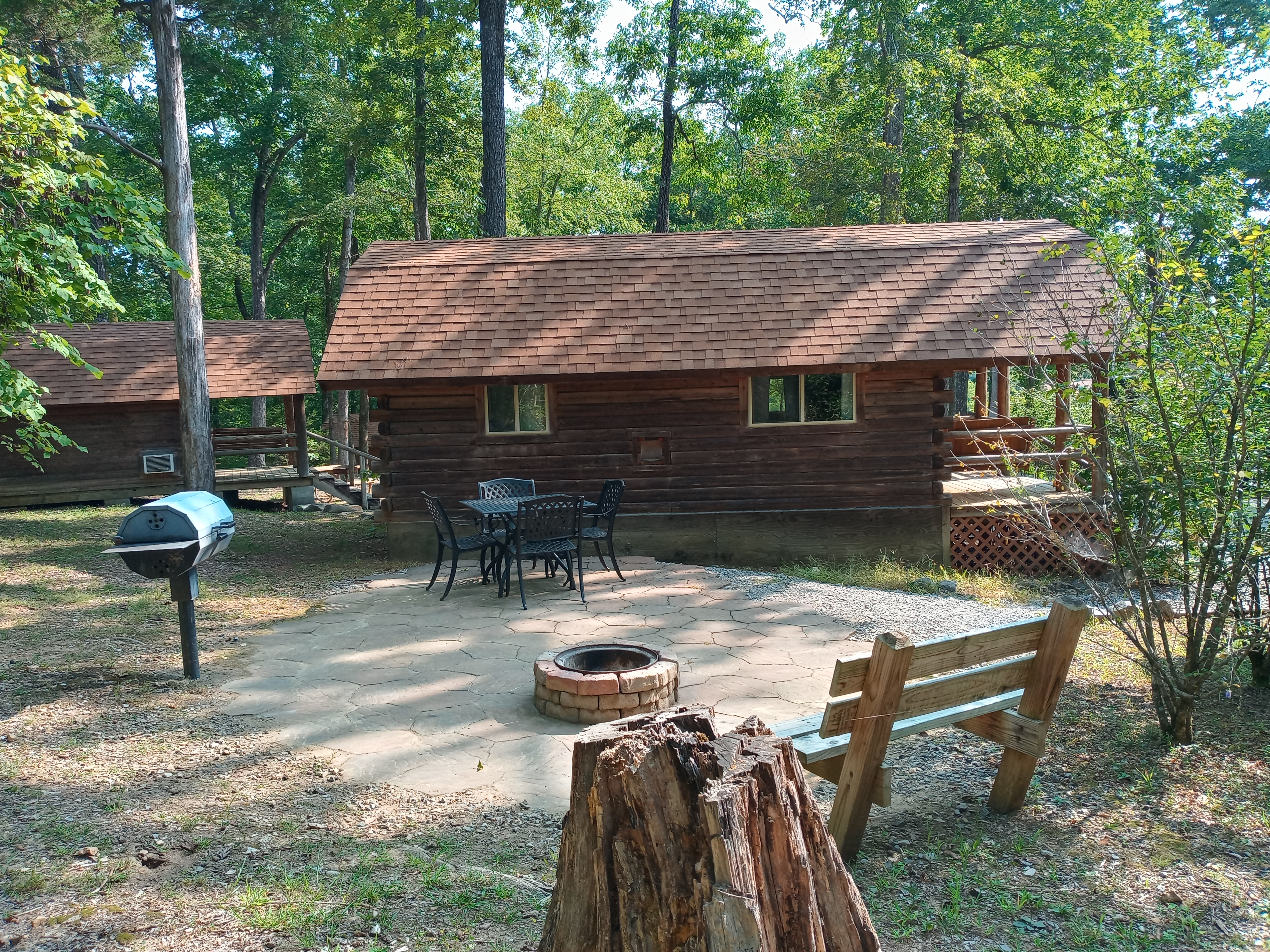 Deluxe cabin, bathroom, kitchenette, patio. Sleeps 4