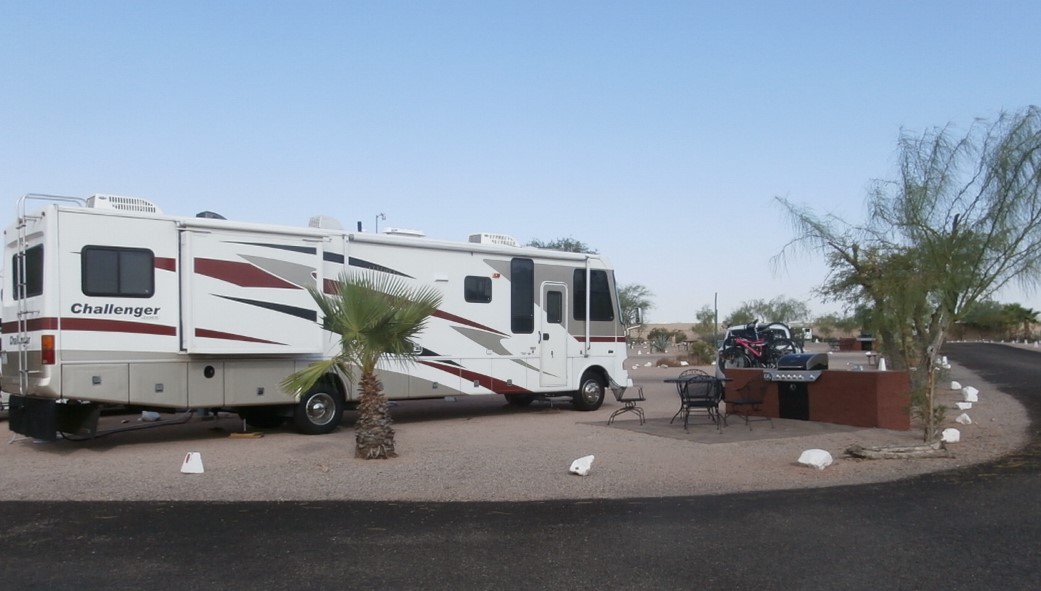Pull Thru, 50/30 Amps, Full Hookups, Deluxe Patio Site Deluxe patio beautifully landscaped, specialty patio furniture, gas barbecue and sink. Best view of the Superstitions. Limited number available.