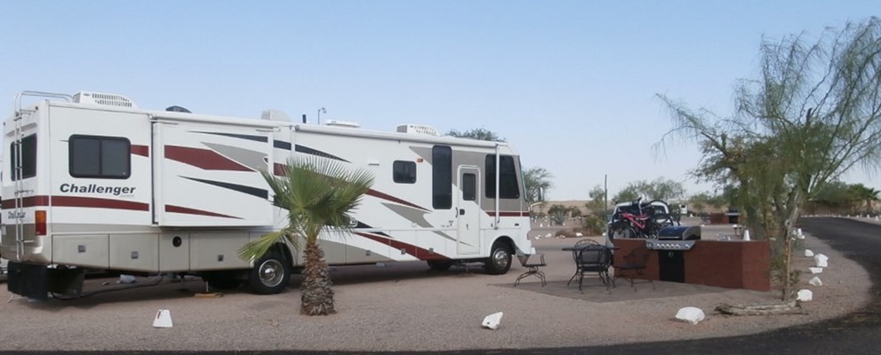 Pull Thru, 50/30 Amps, Full Hookups, Deluxe Patio Site Deluxe patio beautifully landscaped, specialty patio furniture, gas barbecue and sink. Best view of the Superstitions. Limited number available.