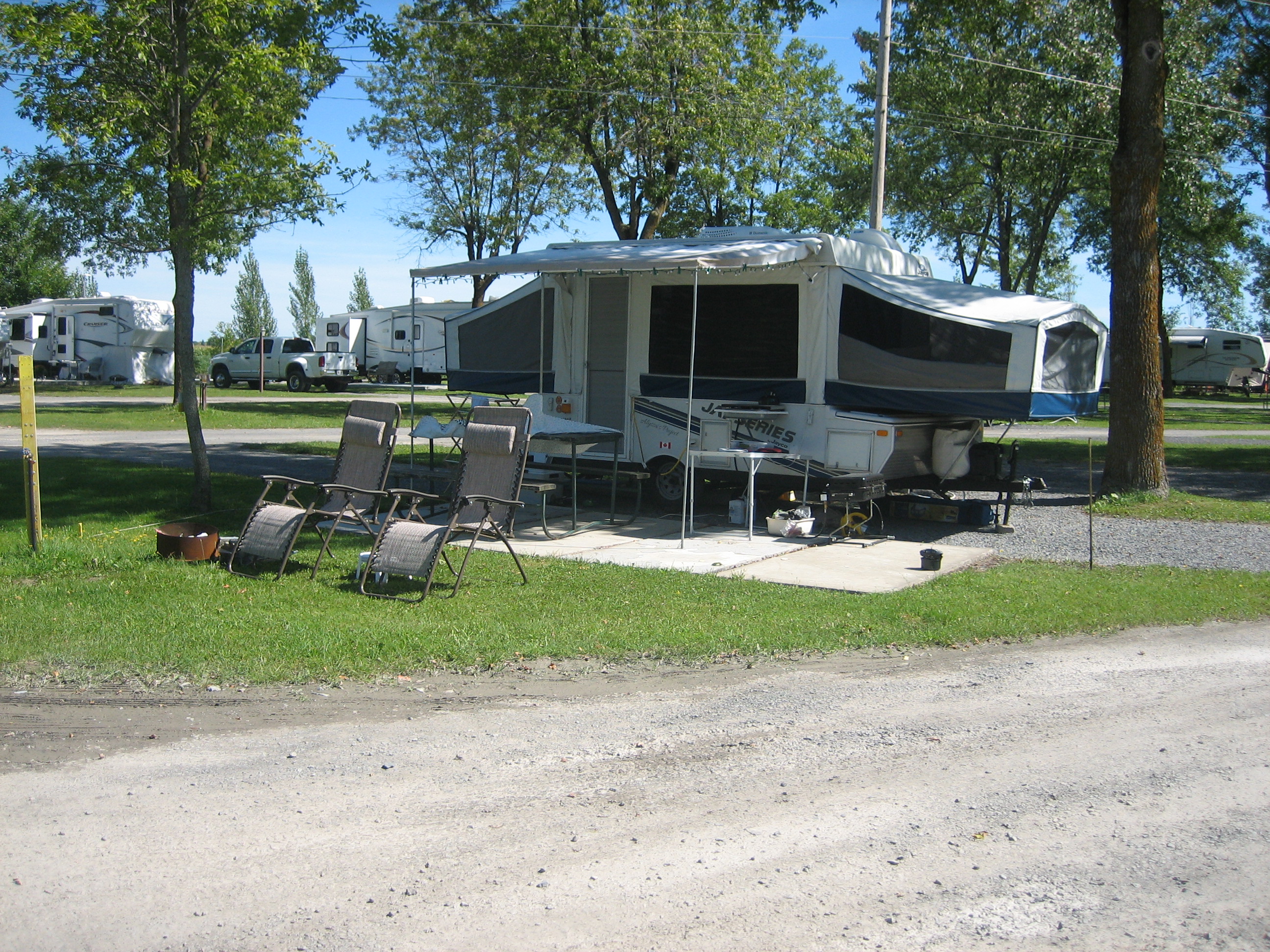 Pull Thru corner site with Patio.  Water and 30 Amp electric