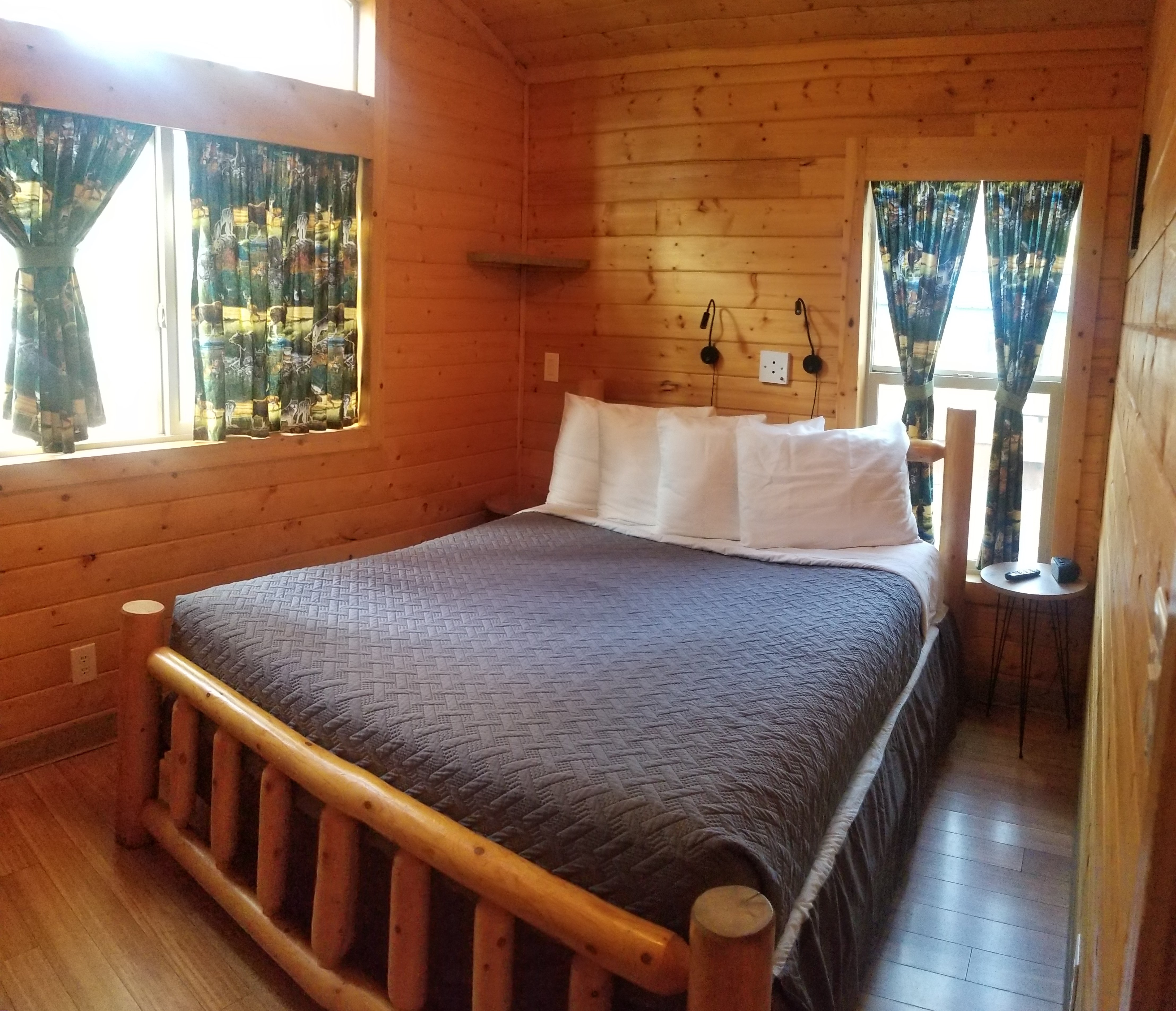 K7 & K8 Deluxe Lodge Cabin that sleeps up to 6 people. Comes with concrete picnic table, concrete patio with table, chairs, umbrella, fire ring and propane BBQ grill. All linens, towels, coffee provided. Also has a Roku TV which has Live TV and online TV streaming services.