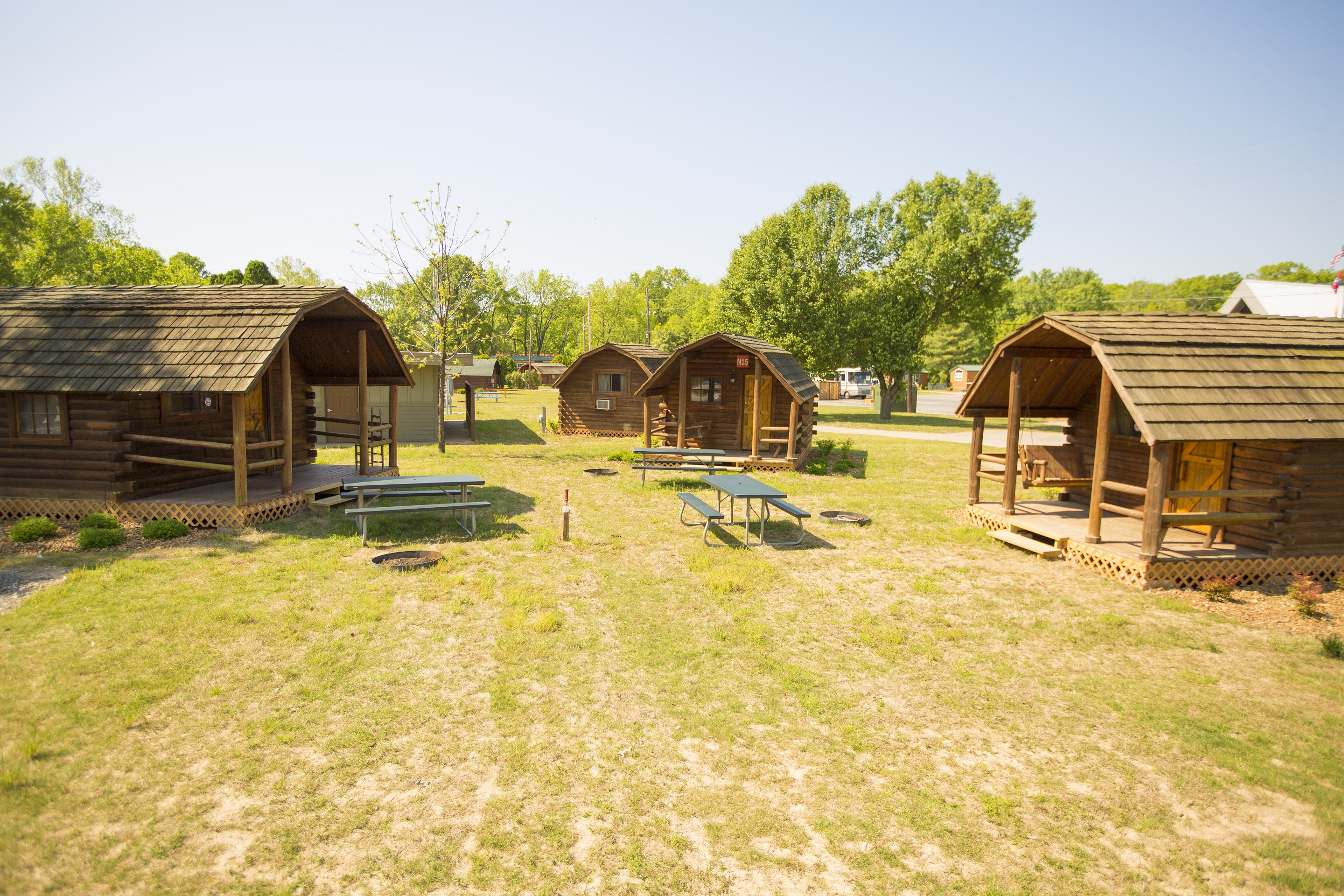 Our rustic cabins are conveniently located to the bath-house and come with charcoal grills, fire rings and a picnic table.