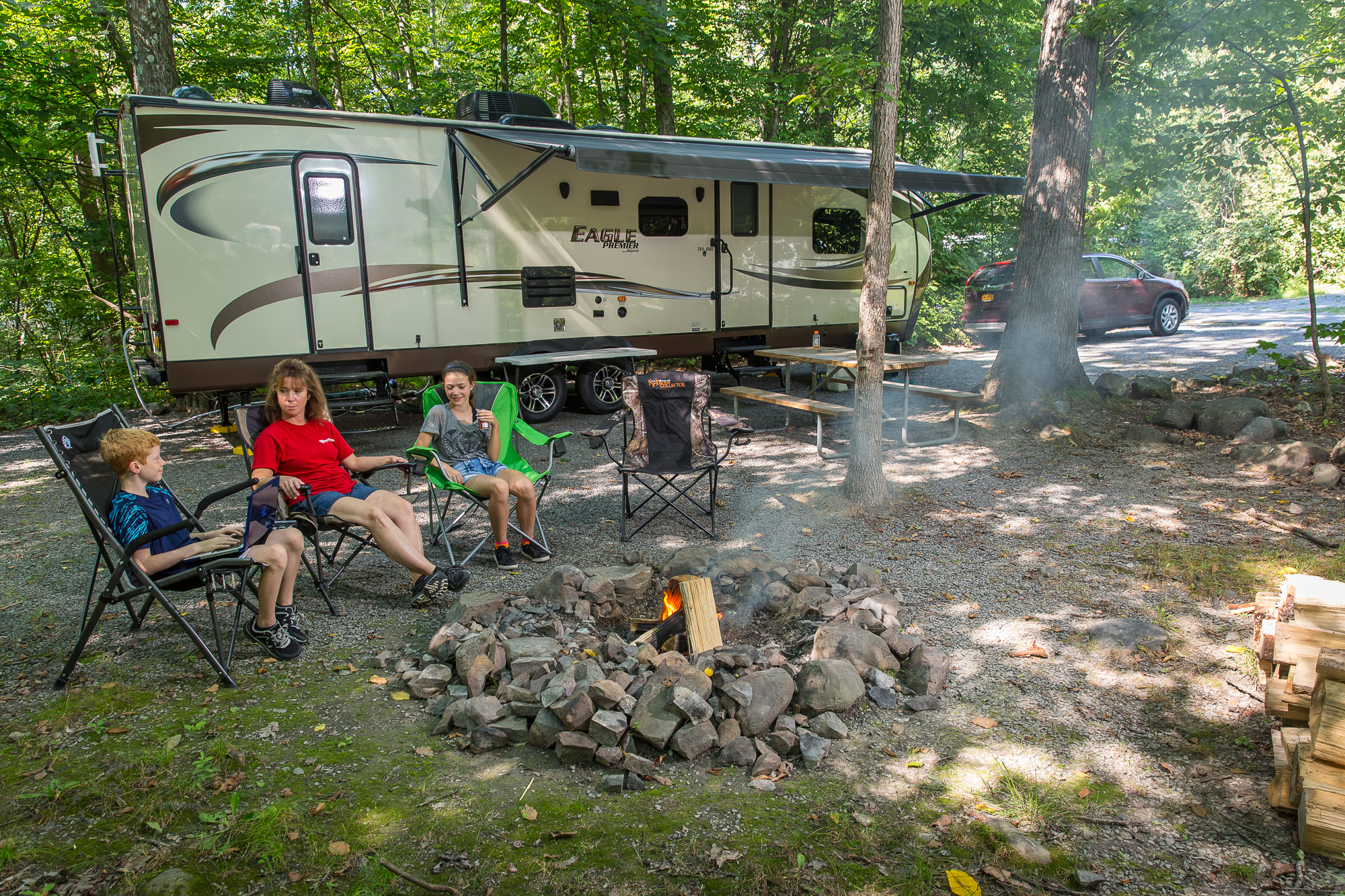 Hanging out around the fire! Fire rings provided at every site!