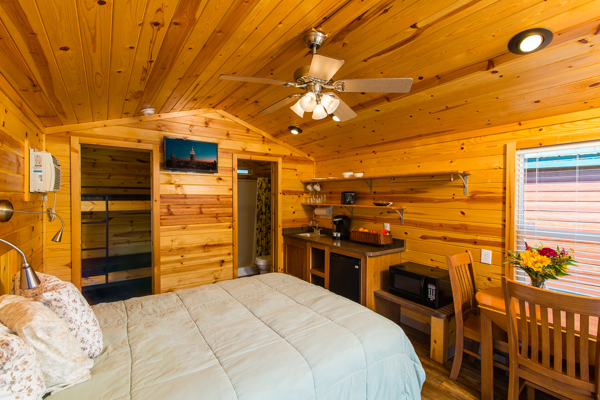 Interior of Waterfront Studio Cabins. Includes Bunk Bed and Queen Bed. Sleeps 4.