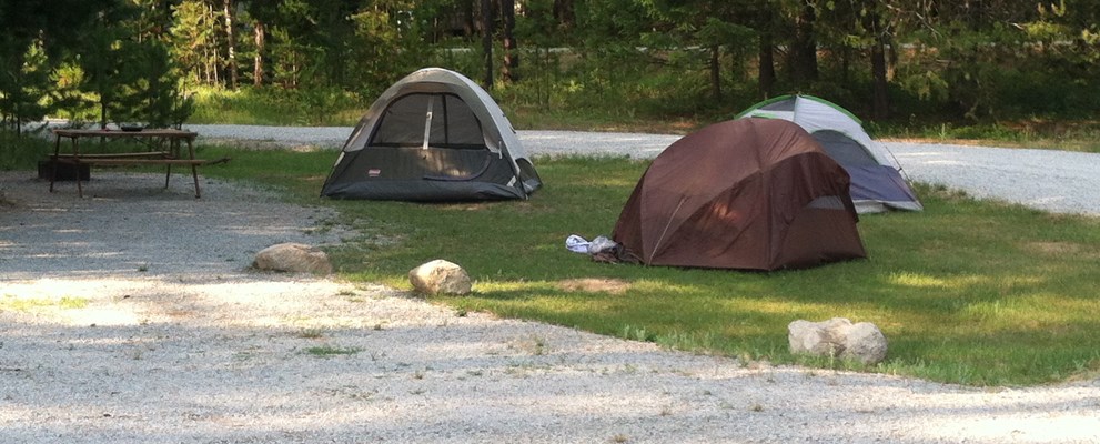 Tent site w/ power and water. No tent pad