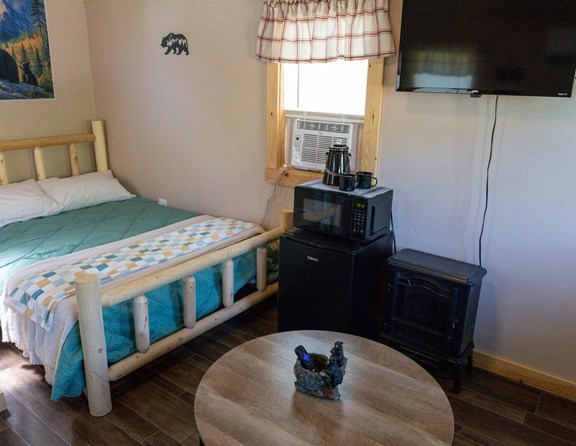 Cozy Camping Cabin with half bath.  Linens not included.