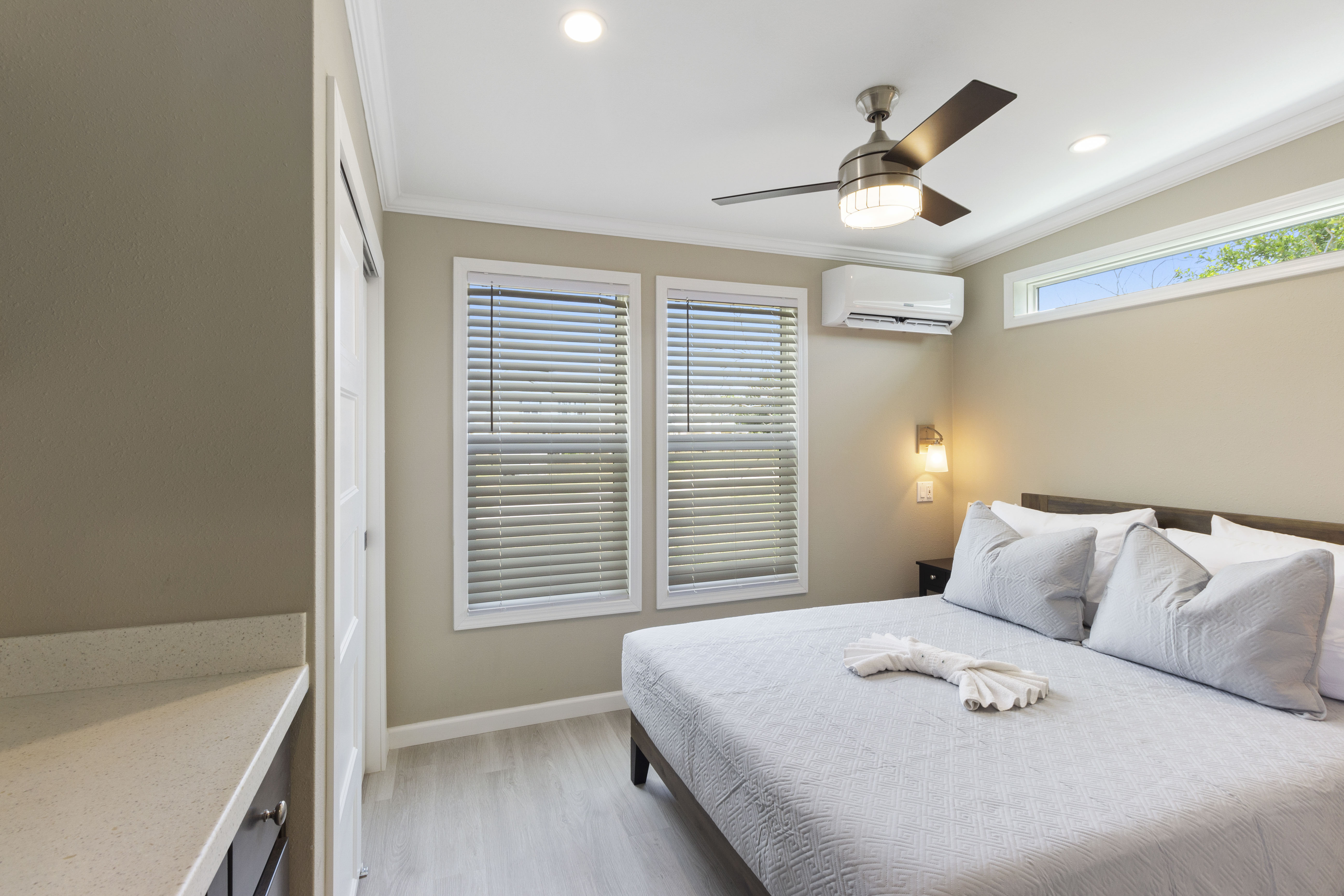 Bedroom with fan and closet