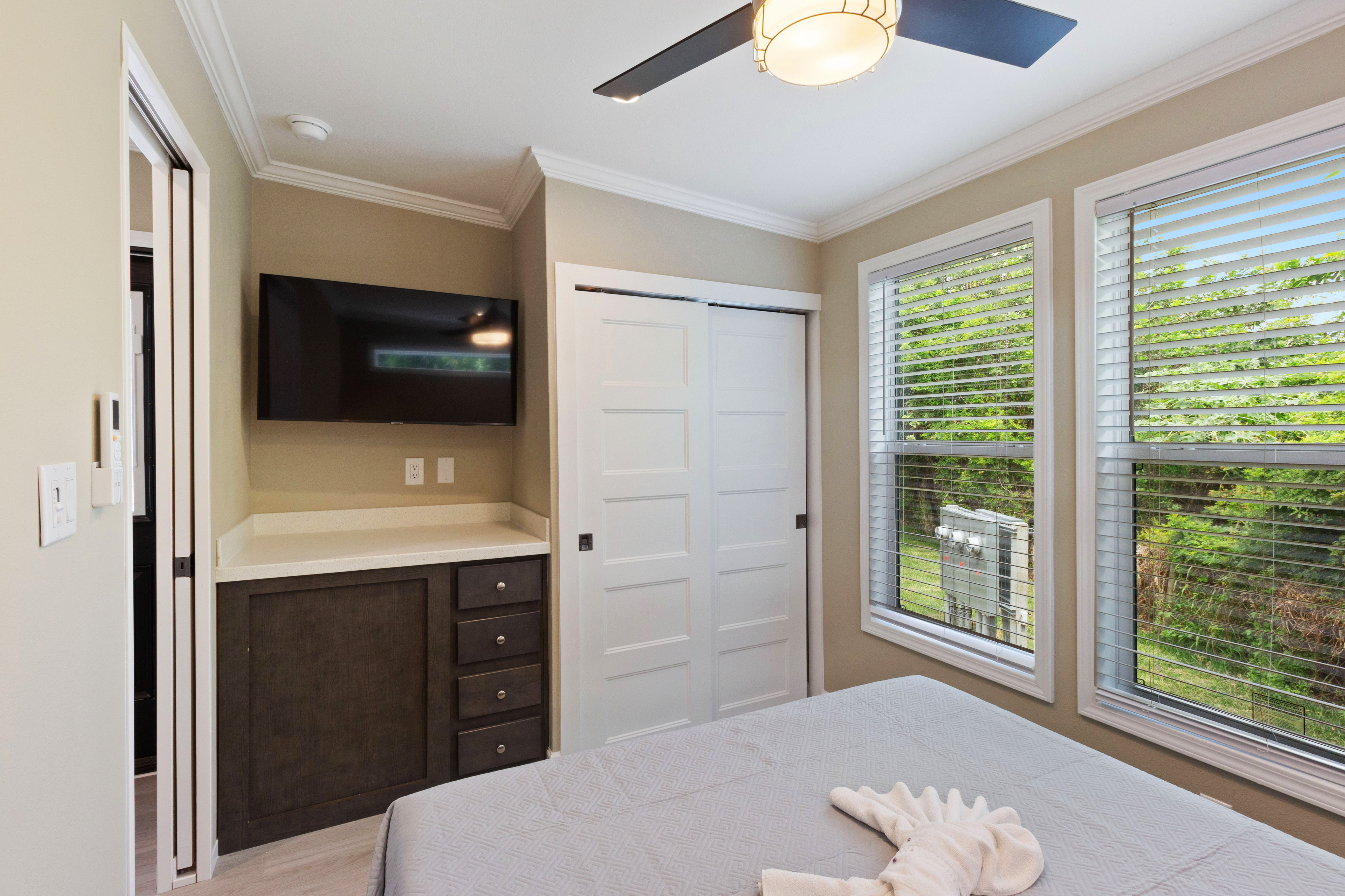 Main bedroom with tv and closet space