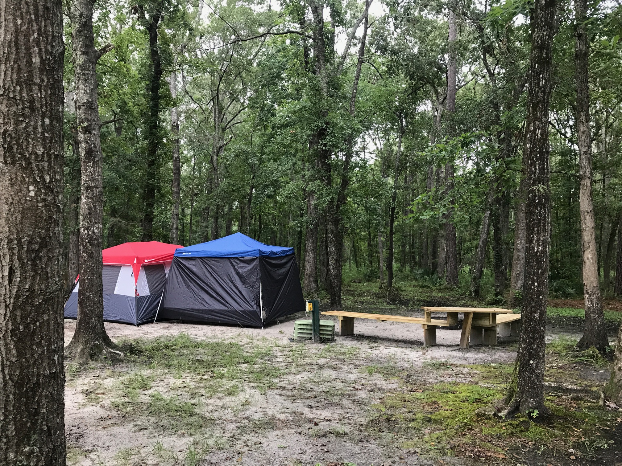 Upgraded Tent site with water & electric, wifi and tent benches. Close to restroom, building & pavilion. Grills available upon request.