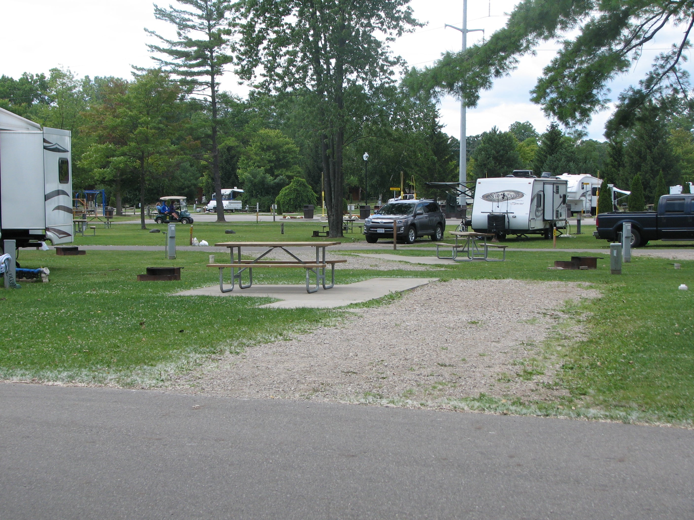 Deluxe site. Park on gravel with a cement patio.