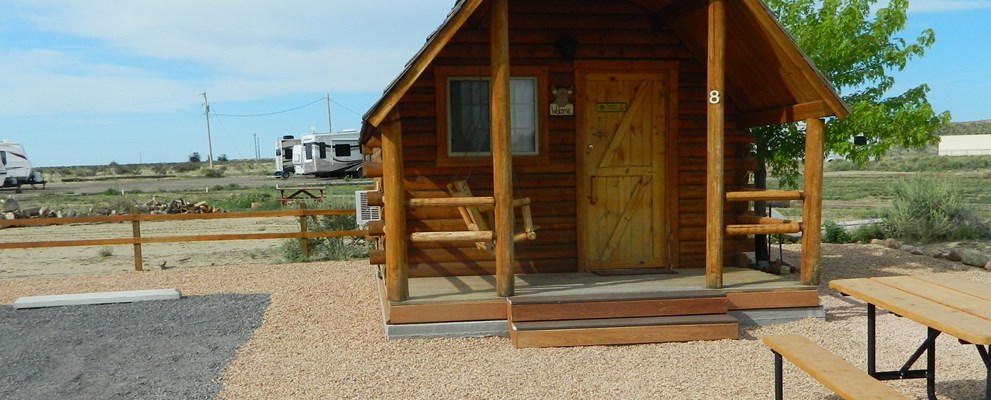 Our basic cabin is your upgrade from a tent.  It has electricity and an air conditioner.  Get out of the wind, rain and off the ground.