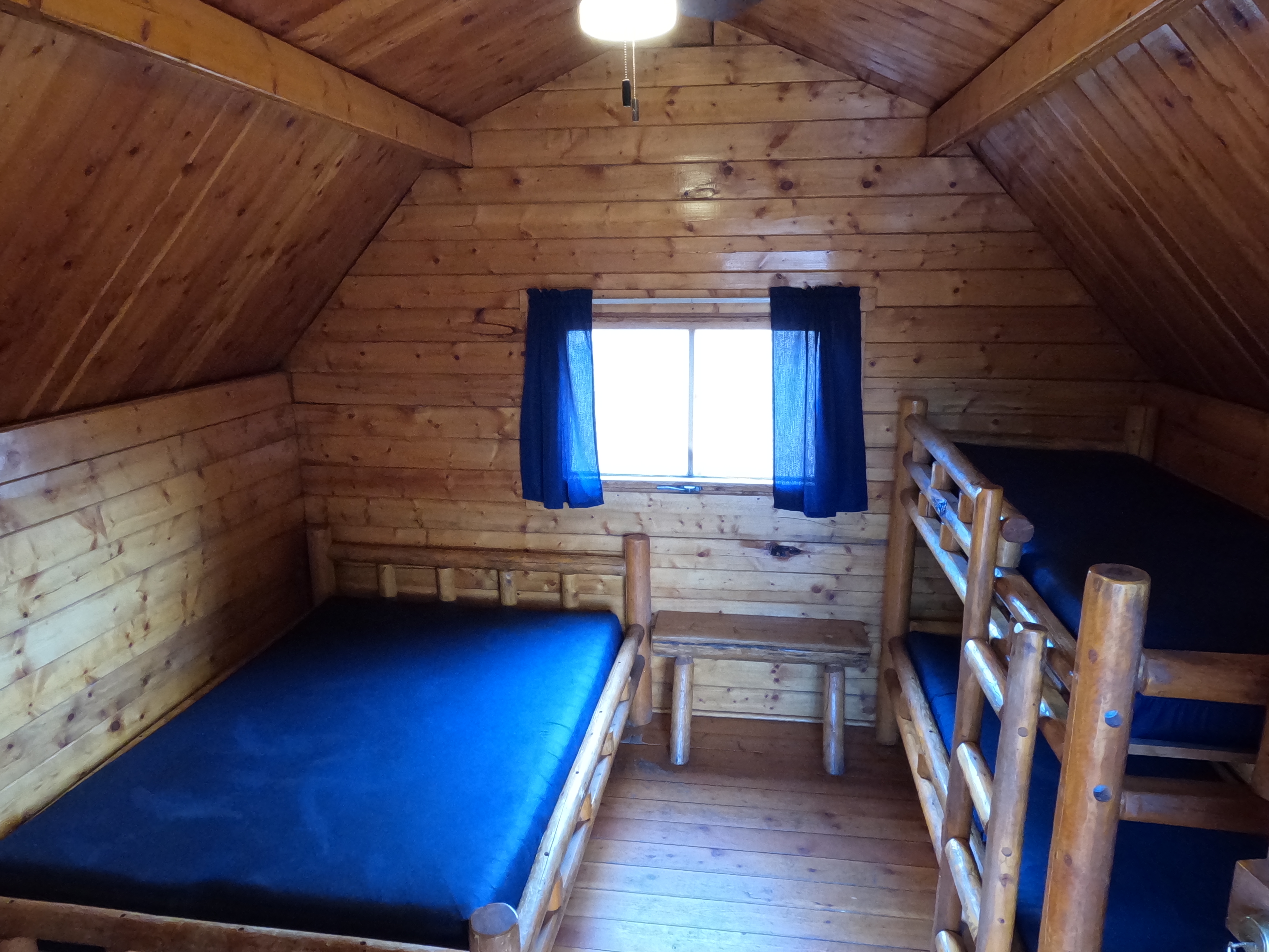 interior of a cabin with two beds