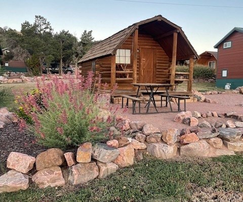 exterior of a cabin with sitting outside