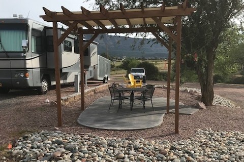 Deluxe Patio with Pergola and Concrete Pad