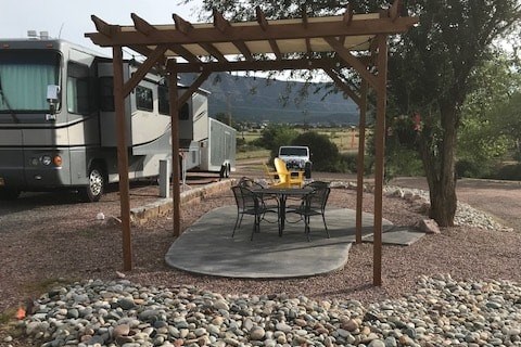 Deluxe Patio with Pergola and Concrete Pad