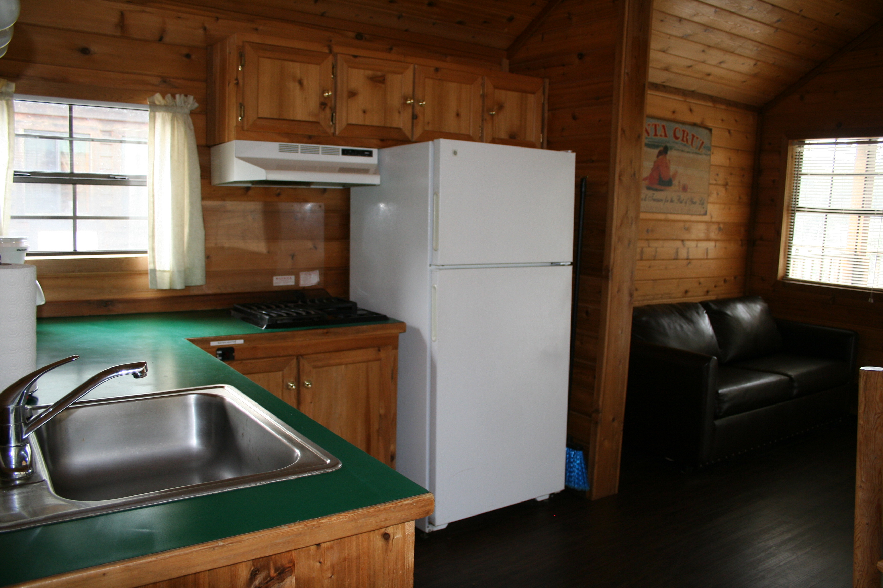This Deluxe Cabin features a stovetop with a full size fridge.