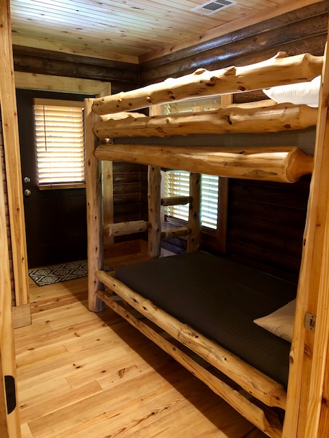 Magnolia Cabin's second bedroom with one set of bunk beds.