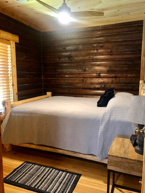 Teresa Cabin's first bedroom with a queen bed