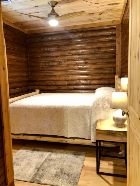 Magnolia Cabin's first bedroom with a queen bed.
