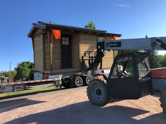 Conestoga Wagons' Bathhouse being unloaded