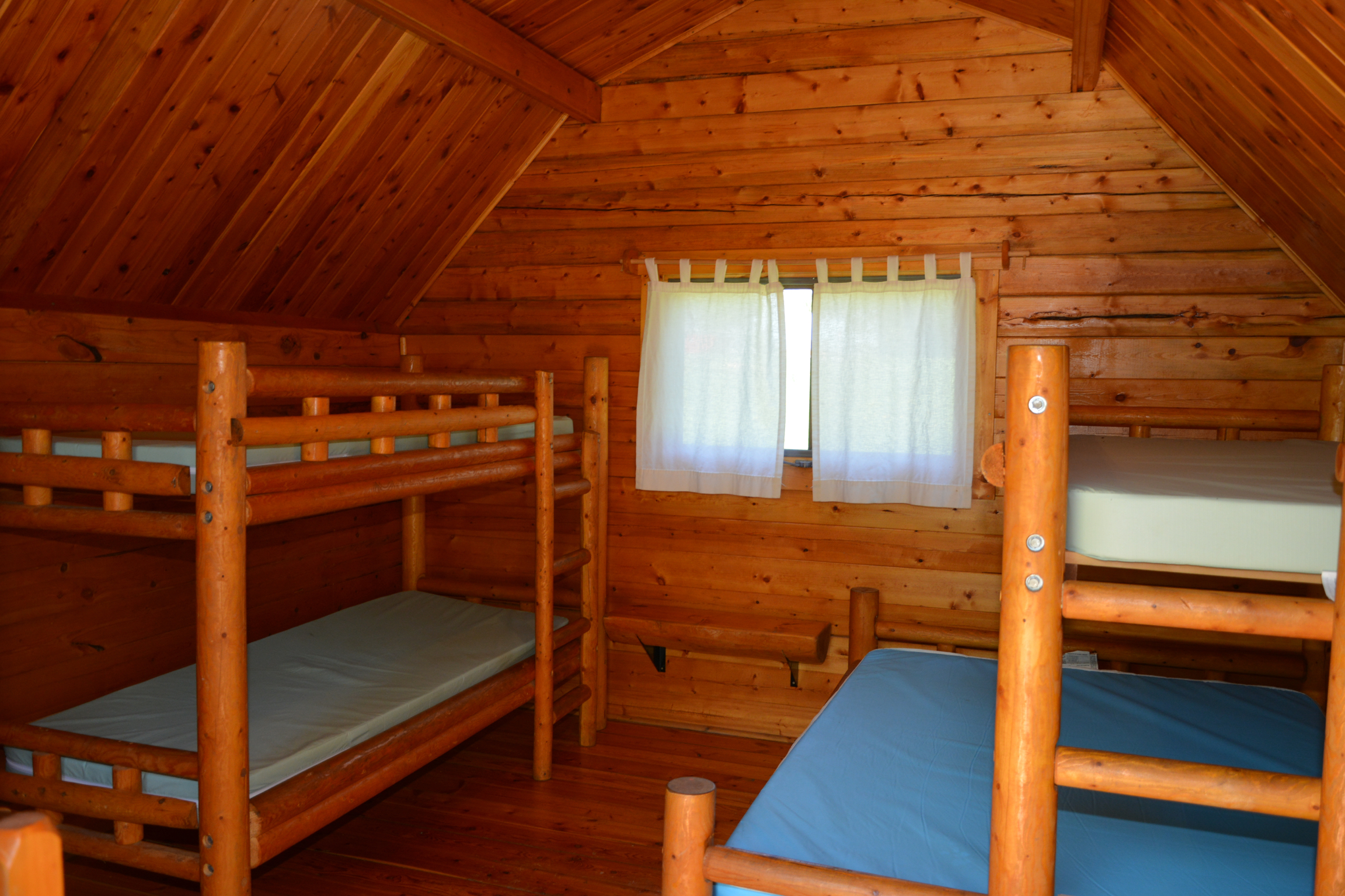 Inside 1 room camping cabin that sleeps 5.