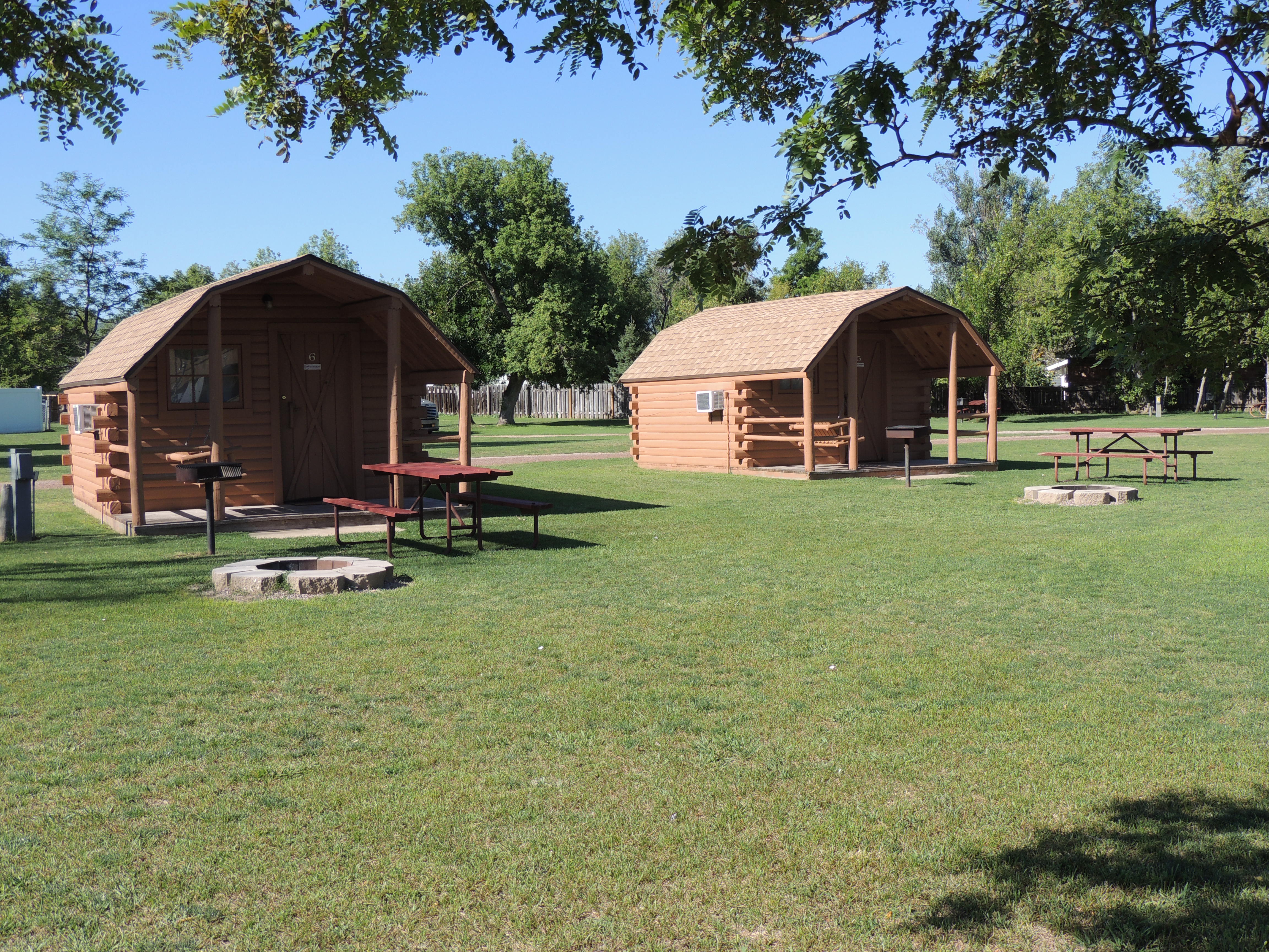 Our basic cabins have water, heat and air conditioning as well as a grassy lawn and a fire pit.
