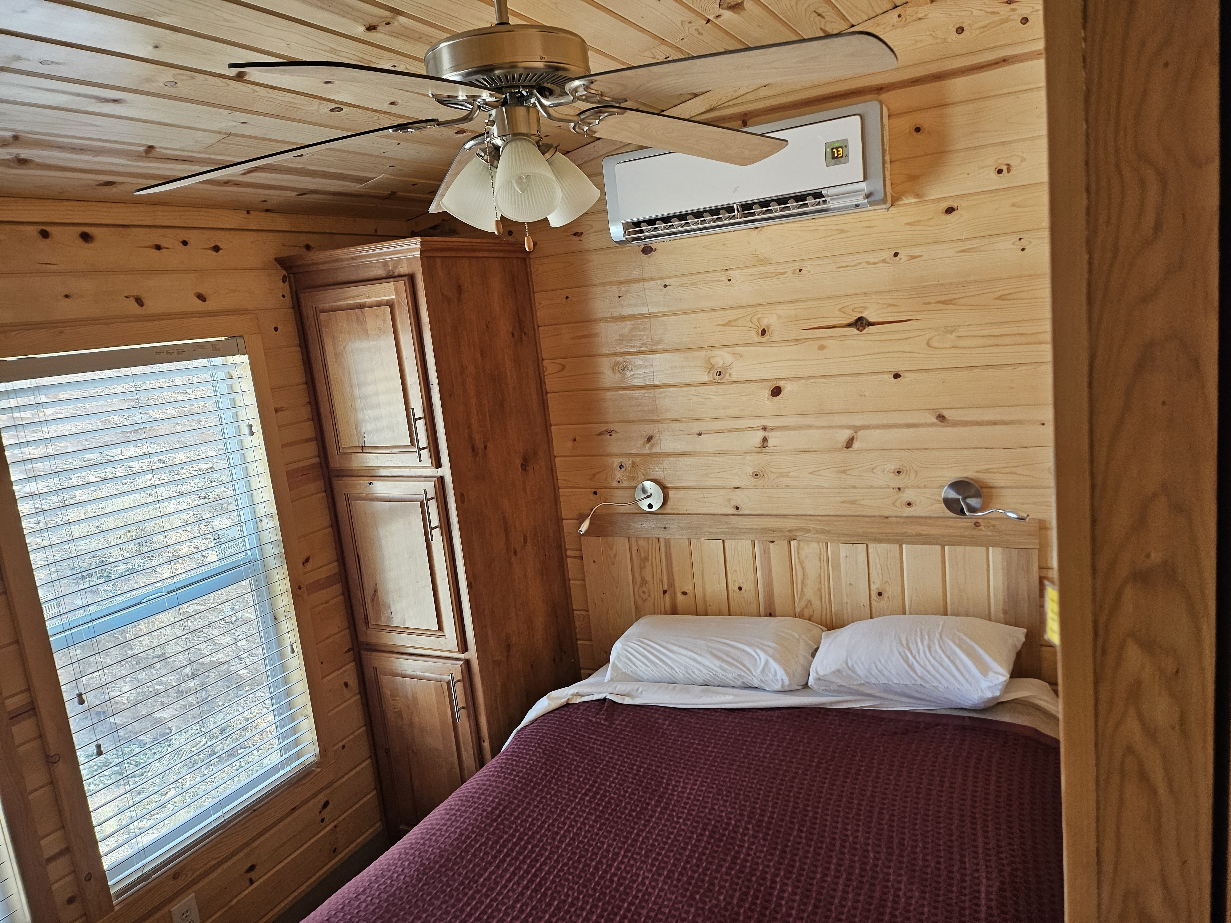 Deluxe Family Lodge Bedroom 1 has storage, heat, AC, and fan for your comfort
