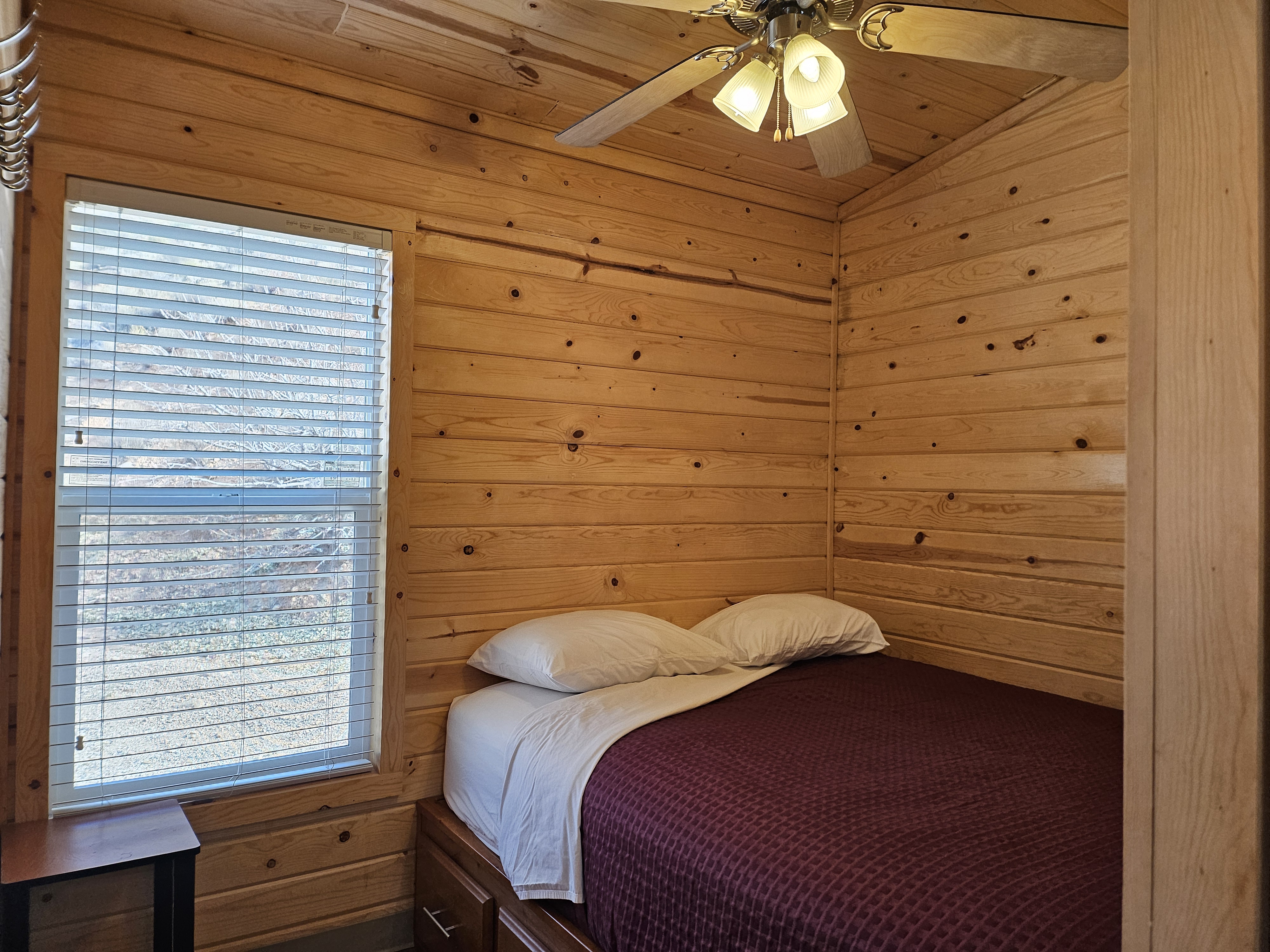 Deluxe Family Lodge Bedroom 2 with storage, heat, AC, and ceiling fan for comfort