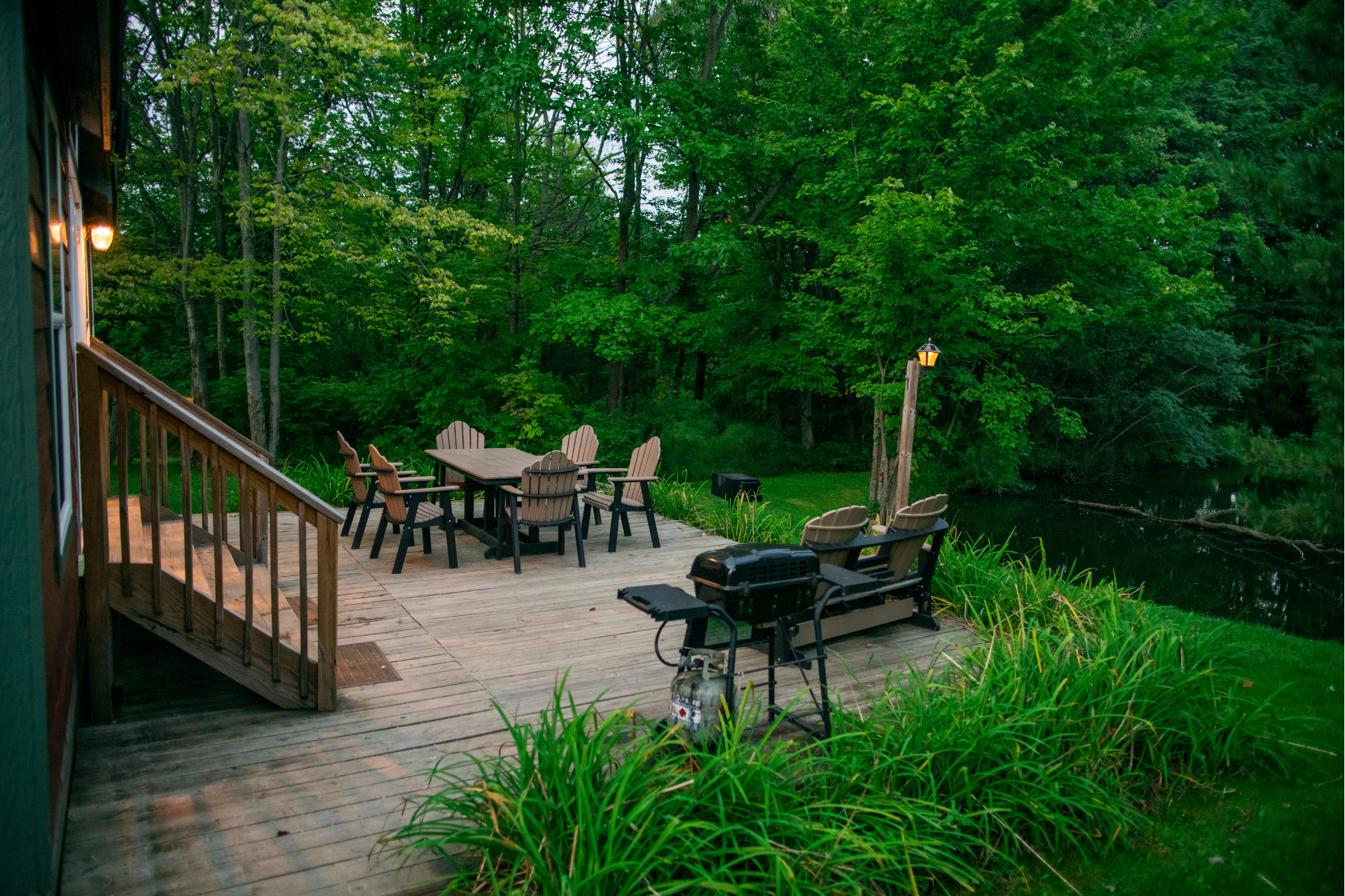 Deluxe Cabin Deck on Pond at Dusk - Thompson