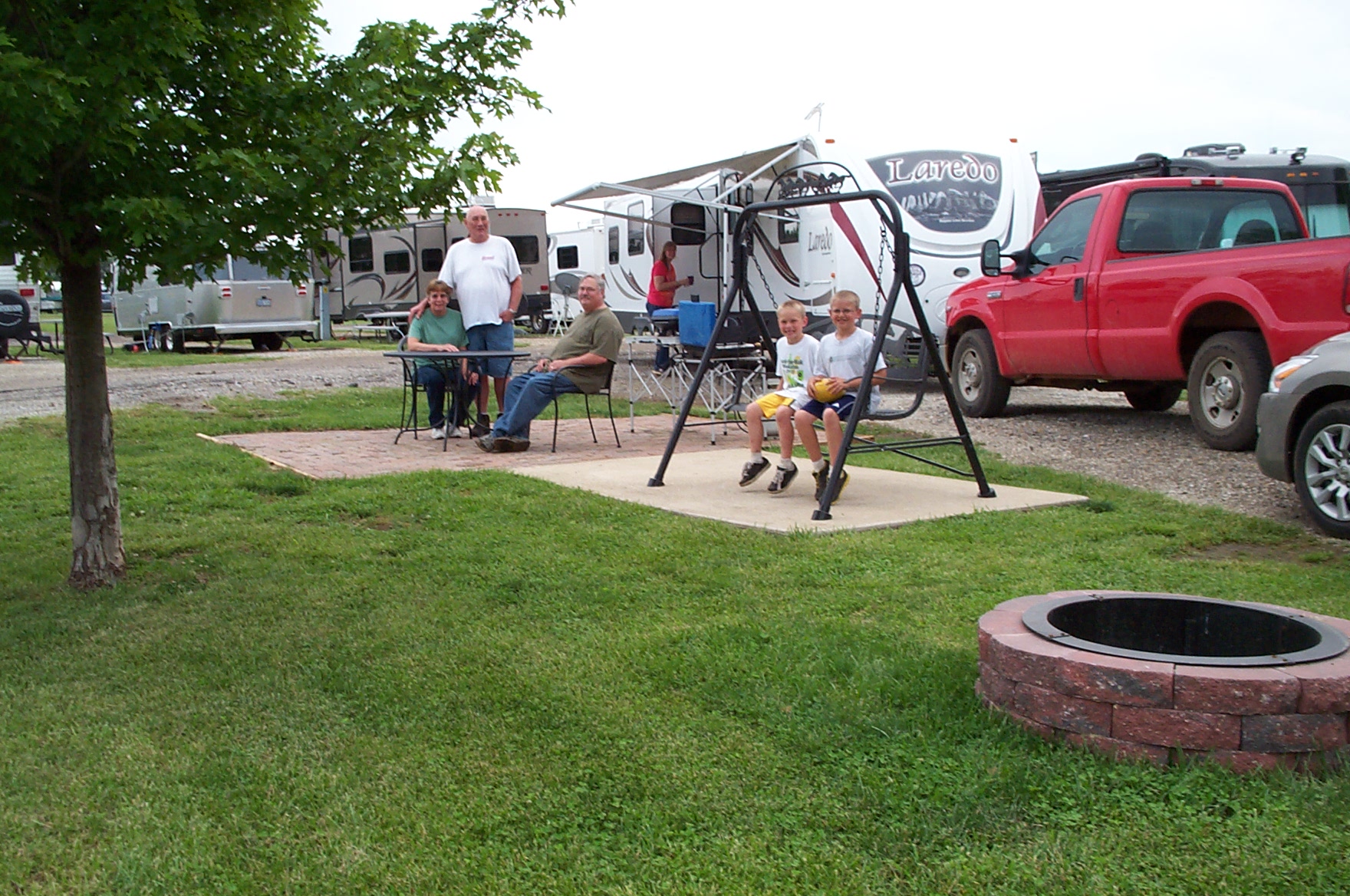 Deluxe Patio Site.  Enjoy one of our most popular  & spacious sites.  Brick Patio, Fire Ring, Patio Swing, and Furniture.