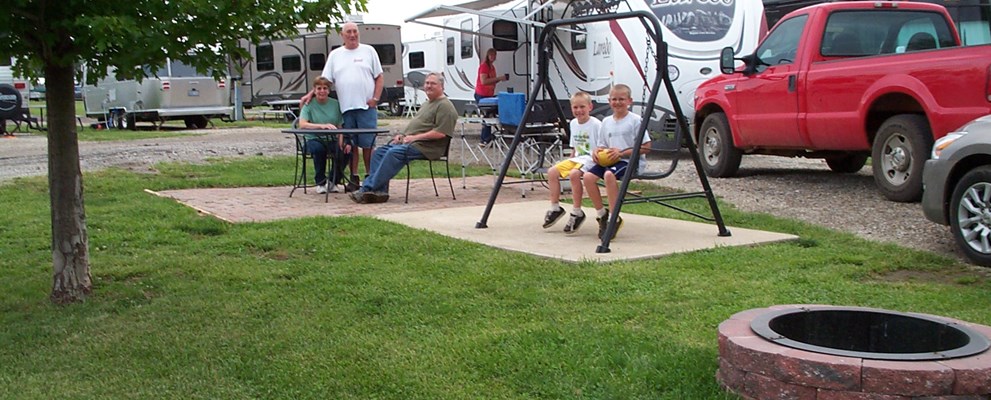 Deluxe Patio Site.  Enjoy one of our most popular  & spacious sites.  Brick Patio, Fire Ring, Patio Swing, and Furniture.