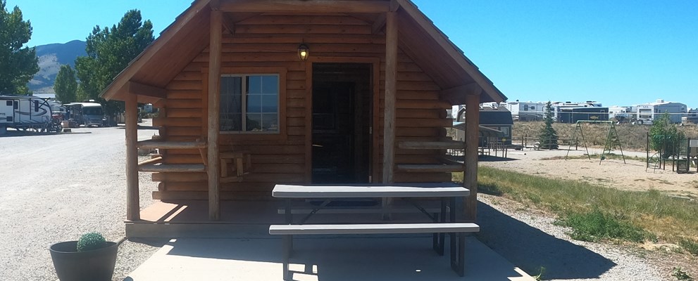 1Bedroom Cabin is open all year! A cozy room with a double bed and a twin bunk bed.  Has a nice heater to keep you warm in the winter. Complimentary coffee/water. It has a small refrigerator and microwave available. Remember to bring your own pillow and sheets/blankets.