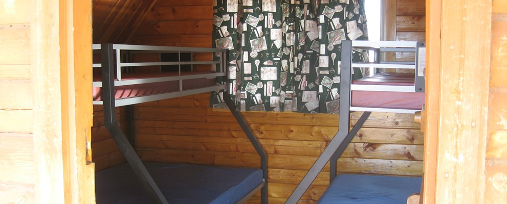 K1 has unique sleeping, 2 double beds, with twin bunks over each, great for family's with 4 kids , will not accommodate more than 4 adults