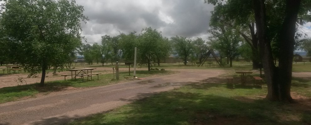 Rare cloudy day for our asphalt end site, Large long pull-thru 30 or 50 amp full service easy in and out, Limited number of these sites they are not together
