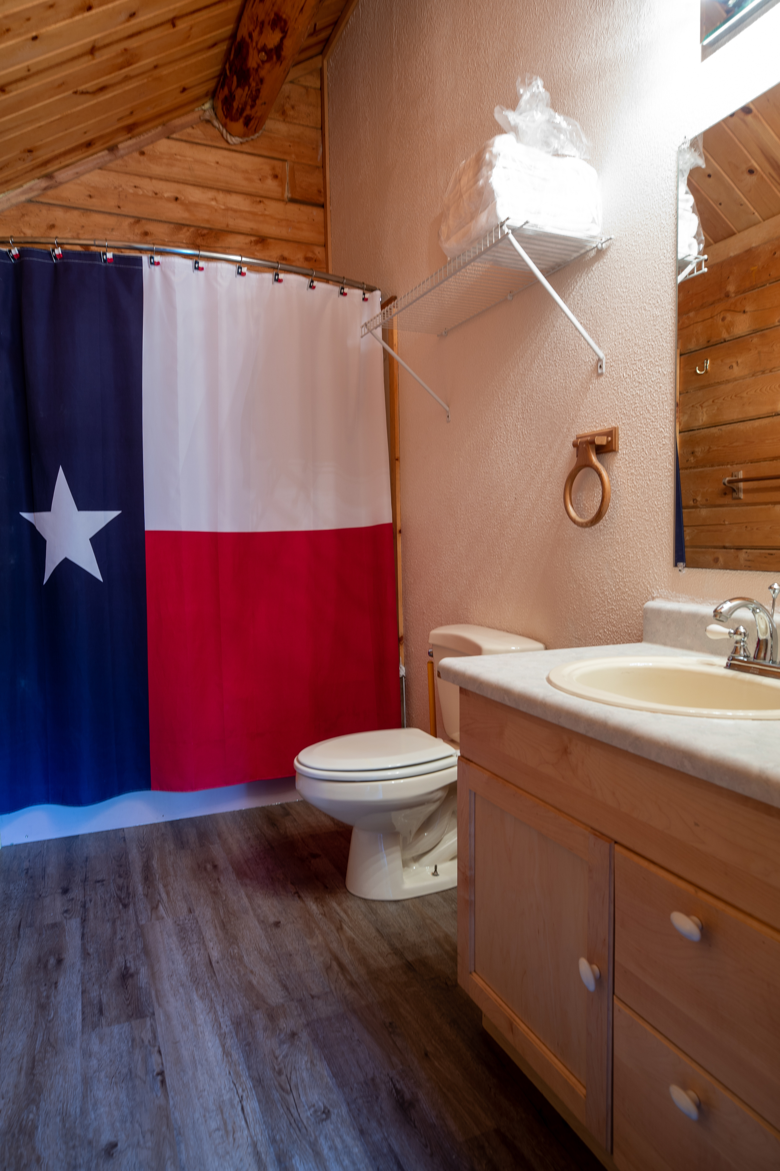 Deluxe Cabin DK2 Bathroom (linens supplied) Whirlpool bath with shower.