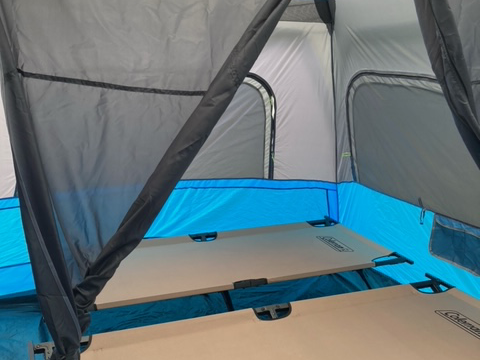 4 cots, 2 on each side with privacy curtains,