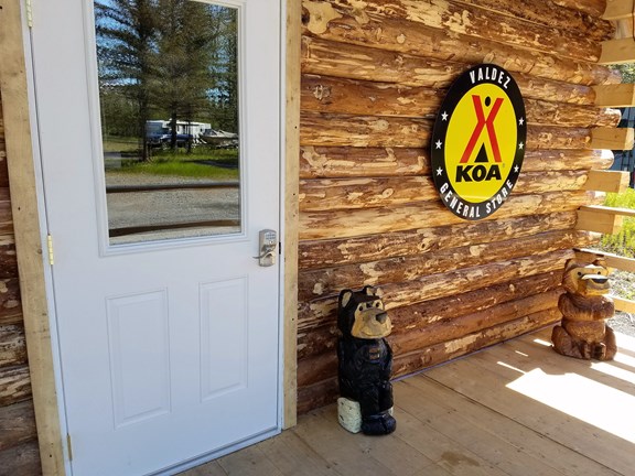 2 bears await you on our porch.
