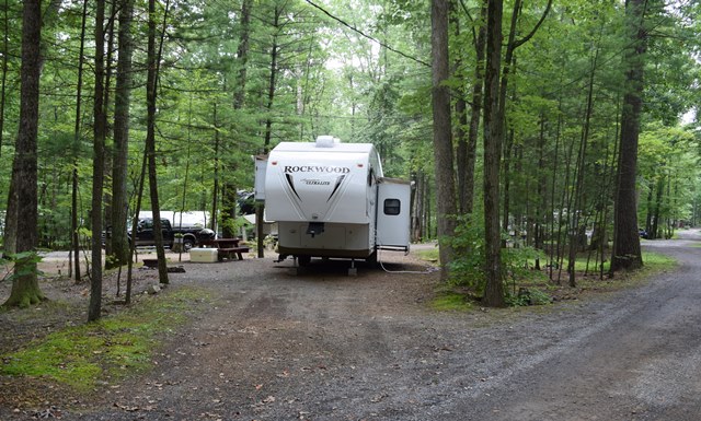 Easy access sites with a real camping atmosphere. Very Spacious wooded sites, 30 amp water and electric, are offered throughout the park. No need to unhook tow vehicles.