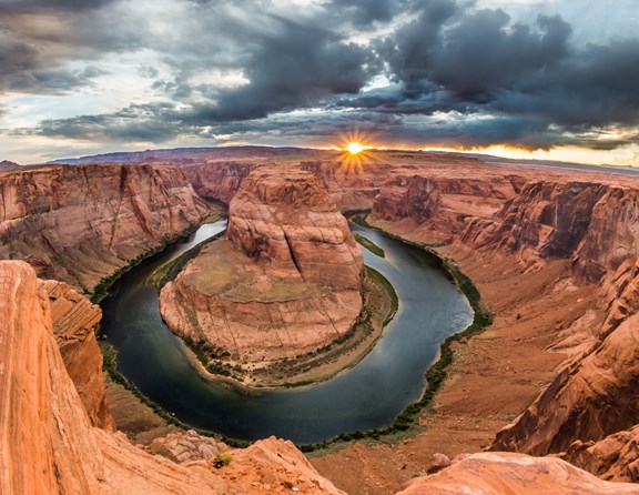  The Grand Canyon — this awe-inspiring sight has been captivating visitors since the national park first opened in 1919. This mile-deep gorge is 10 miles wide and spans 277 miles across Northern Arizona. The canyon holds a huge amount of history and information about our earth and contains some of the oldest exposed rock on the planet. However, its dimensions and geological importance are not what draw over 5 million visitors each year, though. Its spectacular beauty can only be truly understood when you see it in all its glory for yourself at Grand Canyon National Park. <br /><br />There is so much to see and explore when you visit Grand Canyon National Park. To delve into this natural wonder, you may want to enjoy a truly outdoor experience by camping nearby. Whether you prefer the popular attractions along the South Rim or the relative isolation of the North Rim, Grand Canyon camping doesn't get any better than with Kampgrounds of America. There are several KOA Campgrounds nearby that are perfect for avid RVers, cabin enthusiasts and traditional tent campers. Whether you are coming for a weekend or a week, KOA makes a great basecamp for exploring the wonder and inspiring beauty of Grand Canyon National Park. 